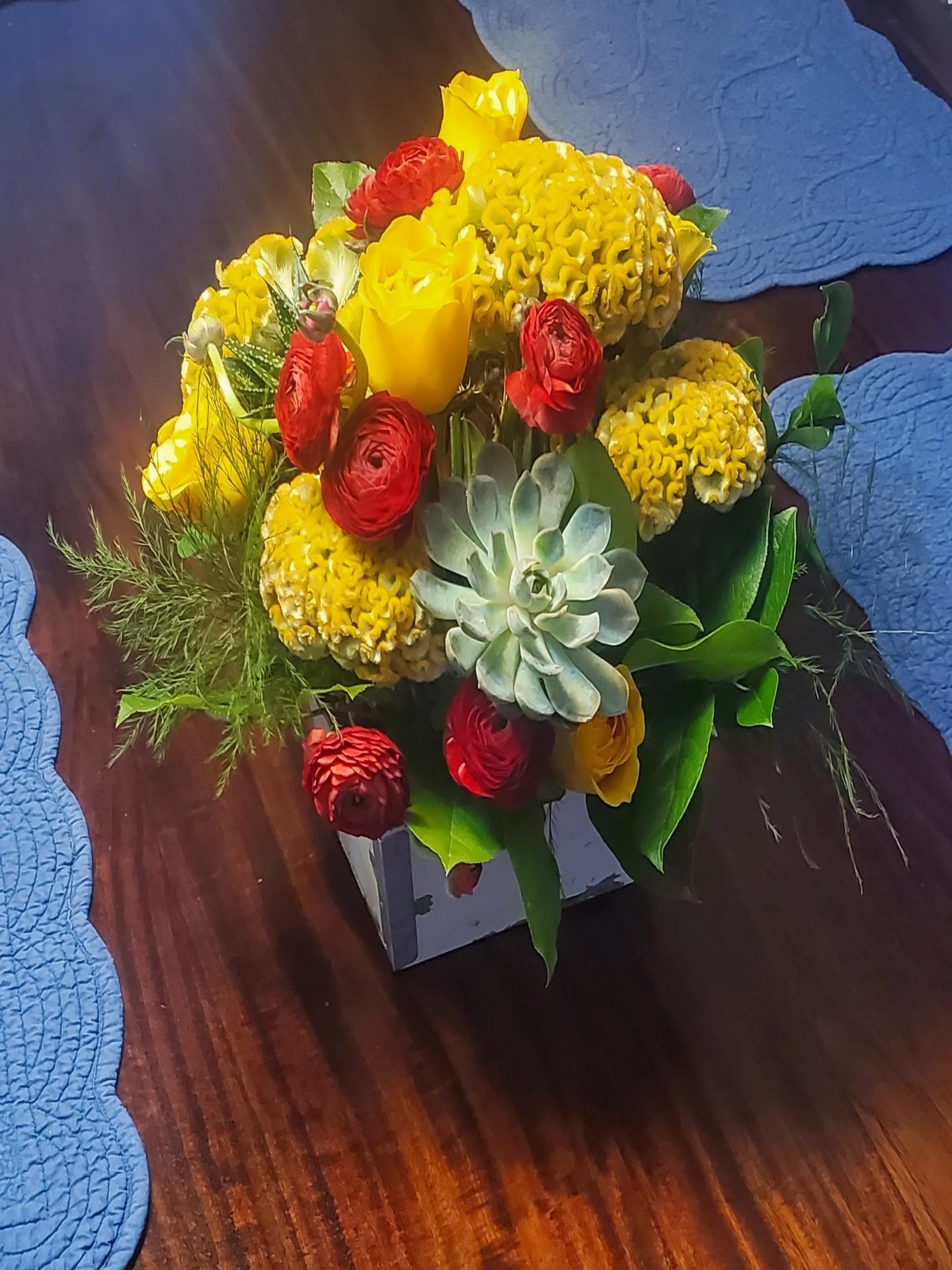 Protea, succulent, and ranunculus bloom box celebrating Texas botanicals